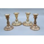 A Pair of London Silver Dwarf Candlesticks together with a similar pair of Sheffield silver dwarf