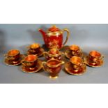 A Carlton Ware Rouge Royale Coffee Service comprising coffee pot, cream jug, covered sucrier and six