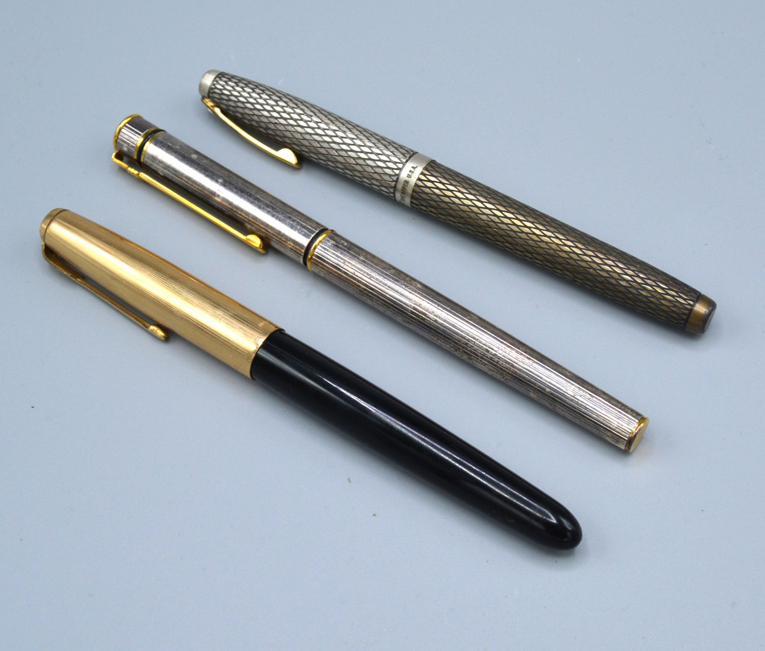 A Sterling Silver Fountain Pen by Sheaffer, another by Diplomat and another by Parker