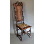 An Early Oak High Back Chair, the shaped cane back above a padded seat raised upon turned legs