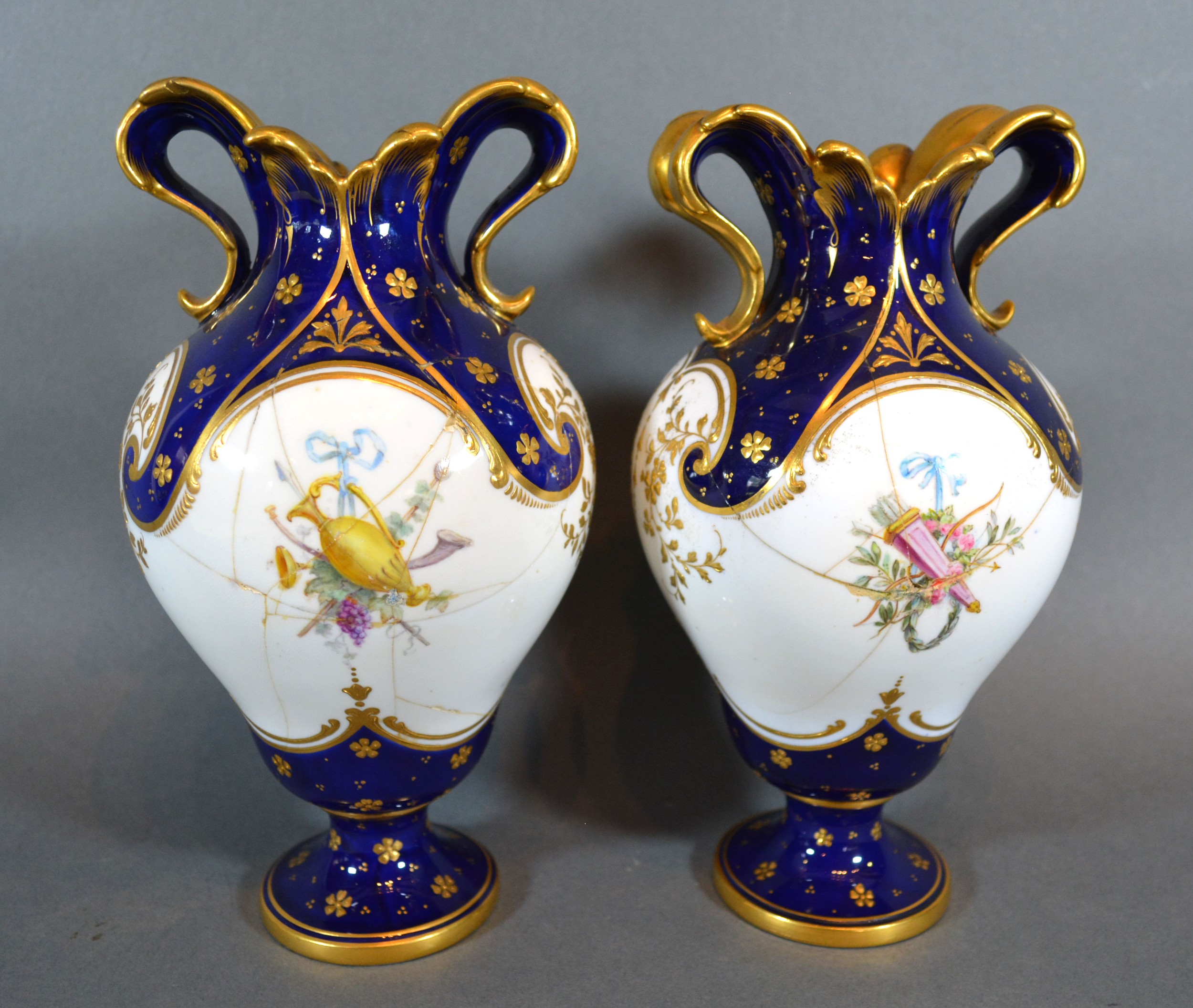 A Pair of Mintons Porcelain Vases of oviform hand painted with putti upon a cobalt blue and white - Image 2 of 4