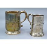 An Edwardian Silver Wasted Mug Sheffield 1909 together with another similar London silver mug 18