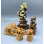 A Pair of Chinese Soapstone Models of Goats with square bases together with three other Chinese
