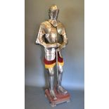 A 16th Century Style Suit of Armour complete with sword upon a wooden plinth 197 cms tall
