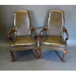 A Pair of George III Style Armchairs each with a green leather upholstered and brass studded back
