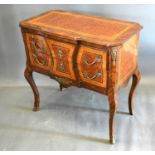 A French inlaid and metal mounted chest, the shaped cross-banded and inlaid top above two drawers