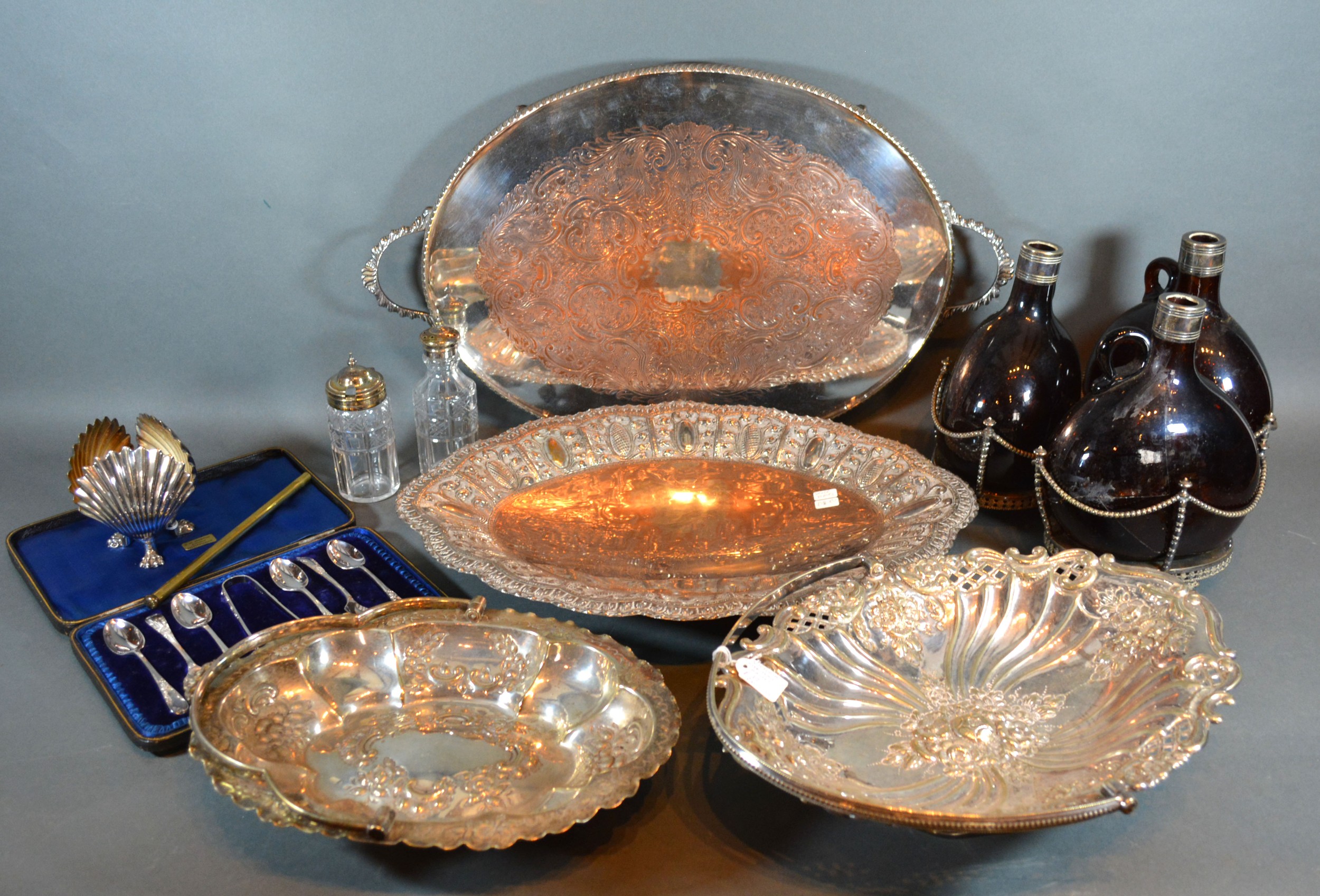 A Silver Plated Cruet Stand with three glass decanters, together with various other silver plated