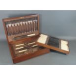 A late 19th century canteen of silver plated flatware in oak case