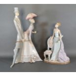 A Lladro Porcelain Model in the form of a Girl Standing By A Chair Holding Flowers, 37 cms tall