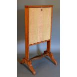 A 19th Century Sheraton Revival Satinwood Escritoire, the fabric hinged front enclosing a fitted