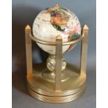A Rotating Stone Inset Globe with clock and thermometer within a brass stand, 28 cms tall