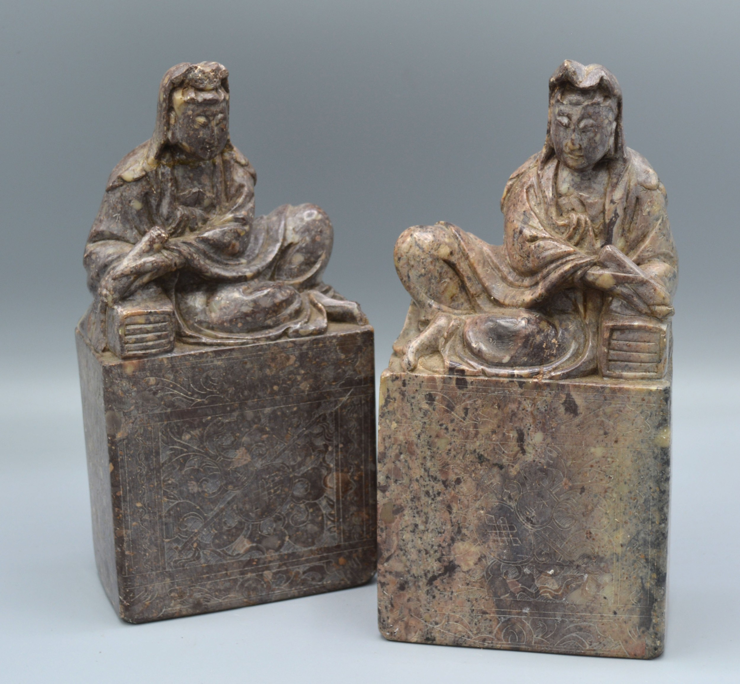 A Pair of Chinese Soapstone Large Seals bearing script to base of figural form, 18 cms tall