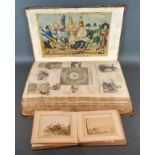 An Early Scrap Album containing coloured prints and a small photograph album