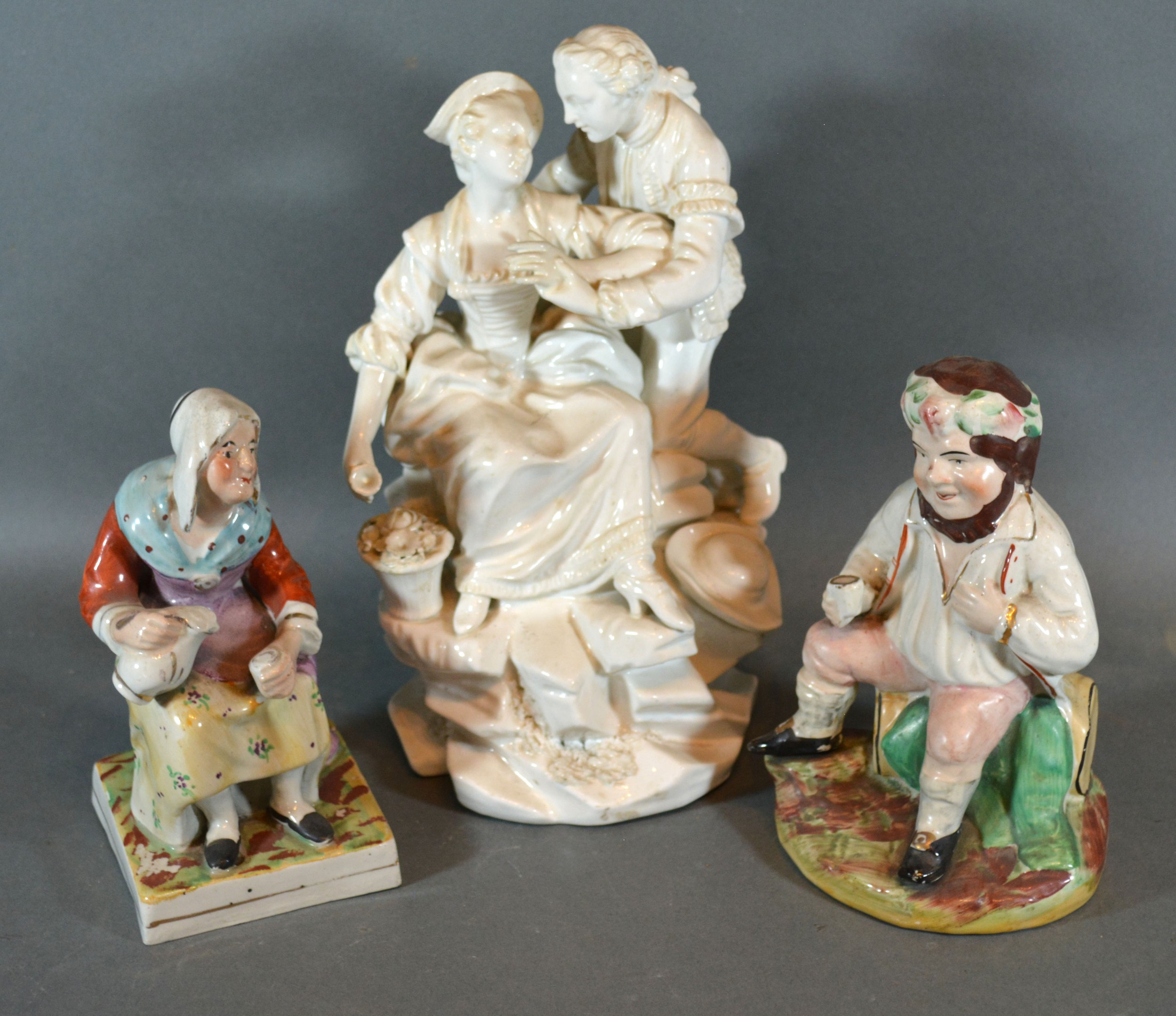 A Staffordshire PearlWare Pottery Figure of a Seated Lady together with another similar of a