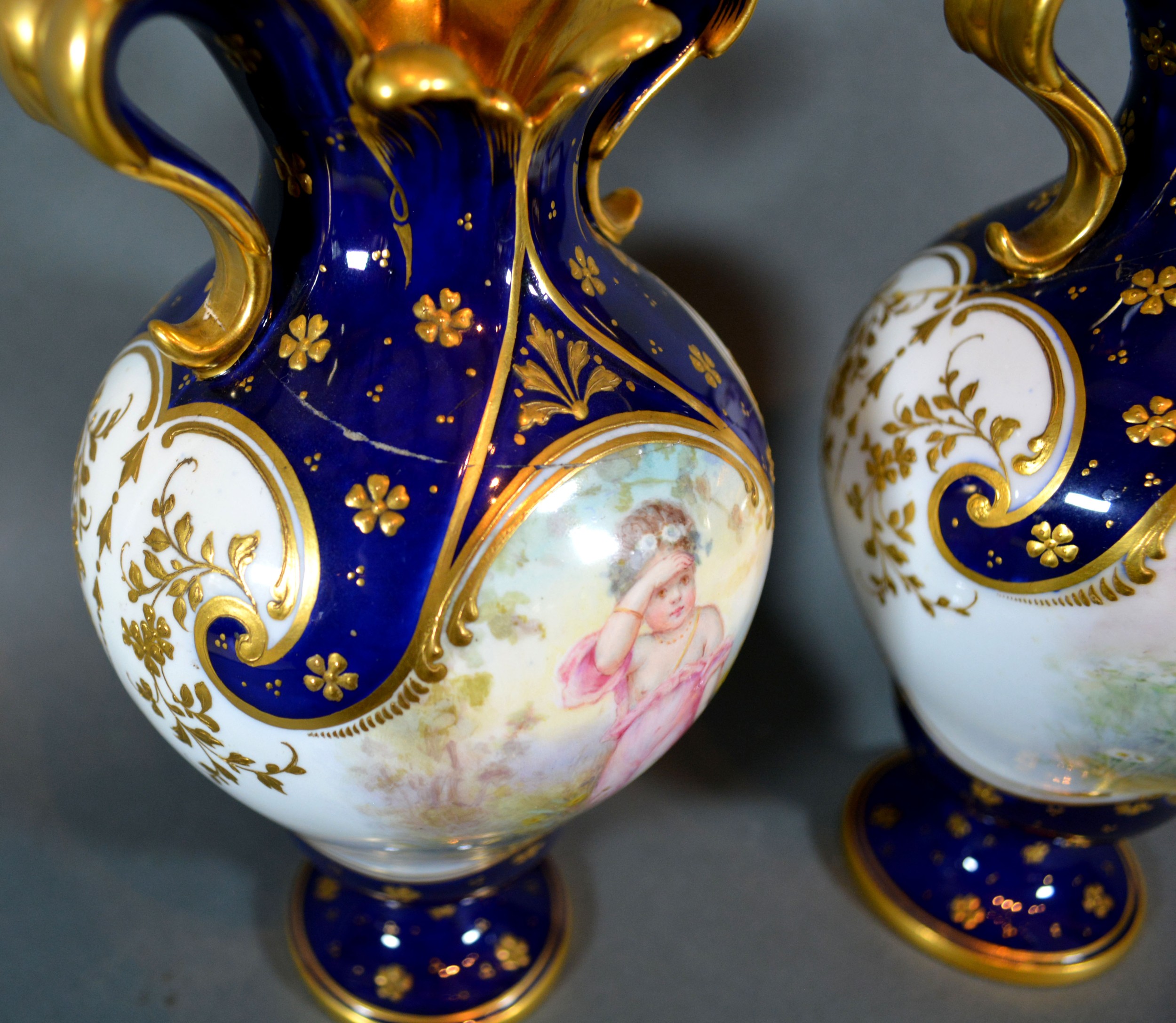 A Pair of Mintons Porcelain Vases of oviform hand painted with putti upon a cobalt blue and white - Image 4 of 4