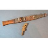A Shona Dagger with carved sheath 36 cms long together with an African small carved figure 10 cms