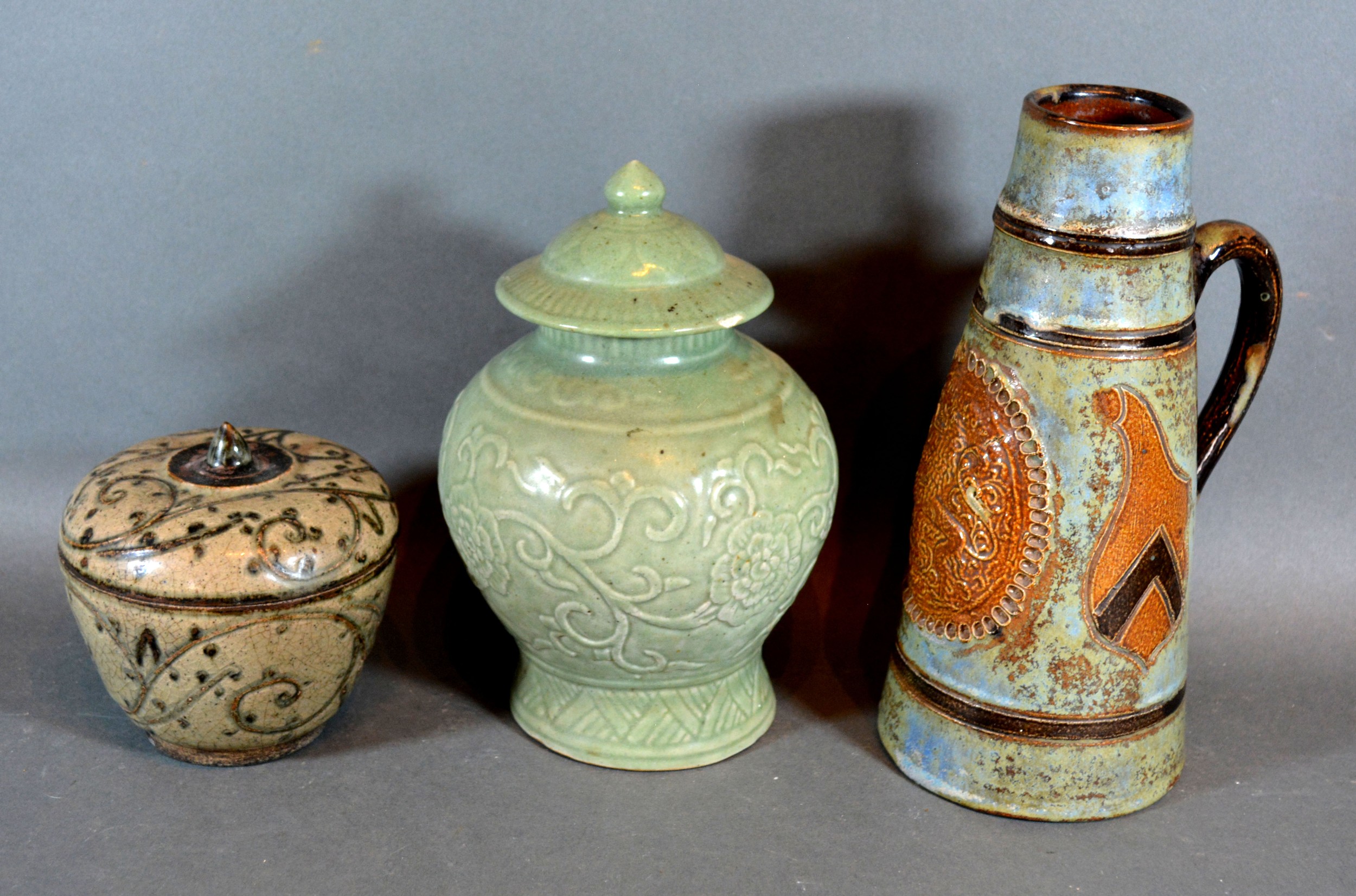 A Chinese Celadon Covered Vase of Oviform, together with a stone ware jug vase and a stone ware