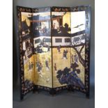 A Chinese Lacquered Four Fold Screen depicting figures within a landscape amongst buildings, the