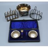 A London Silver Sugar Bowl together with two silver four division toast racks and a pair of