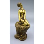 A Chinese Bronze Model in the form of a Girl seated on a rock, 25 cms tall