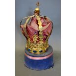 A Brass Crown of pierced form with paste stones upon circular plinth 50 cms tall