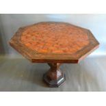 A French style inlaid large octagonal centre table, the inlaid top above a similar centre column,
