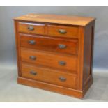 A Late Victorian/Early Edwardian Chest of Two Short and Three Long Drawers with metal handles raised