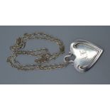 A Sterling Silver Pendant by Tiffany & Co. of heart form inscribed 1894 and the initials AE together