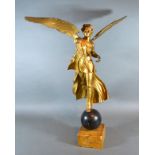 A 19th Century Gilded Metal Figure in the form of Winged Victory upon a globular marble socle 57 cms