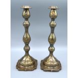 A Pair of London Silver Candlesticks each with a removable sconce upon a shaped base, 16 ozs.