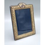 A London Silver Rectangular Photograph Frame of embossed form 19 x 14 cms