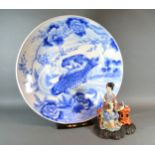 A Japanese Large Underglaze Blue Decorated Charger 55 cms diameter together with a Chinese porcelain