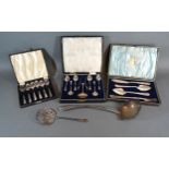 A Birmingham Silver Cased Set of Six Teaspoons with matching tongs and sugar sifter spoon together