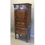 A 19th Century Oak Hall Cupboard, the moulded cornice above a moulded door, the lower section with a