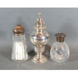 A London Silver Sugar Caster 8 ozs. together with a silver topped and cut glass sugar caster and a