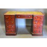 A Victorian Mahogany Inverted Twin Pedestal Desk, the tooled leather inset top above nine drawers