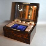 A 19th Century Coromandel Dressing Case the domed hinged cover enclosing a fully fitted interior