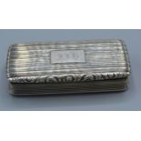 A William IV silver snuff box by Nathaniel Mills, the hinged cover enclosing a silver gilt interior,