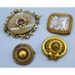 A Victorian brooch of circular form together with three other similar brooches