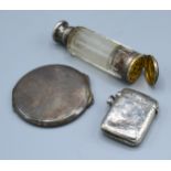 A Birmingham Silver Vesta Case together with a silver compact, a glass and silver mounted scent