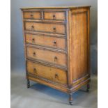 An Early 20th Century Oak Chest of two short and four long graduated drawers with brass drop handles