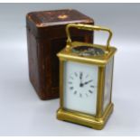 A French Brass Cased Carriage Clock with repeater movement, lever escapement, the enamel dial with