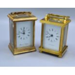 A Brass Cased Carriage Clock by St. James Metamec of England together with another similar brass