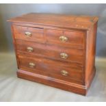 A Late Victorian Walnut Chest of two short and two long drawers with brass handles raised upon a