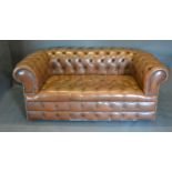 A Beige Leather Button Upholstered Chesterfield Type Sofa, 175 cms wide, 90 cms deep, 70 cms high