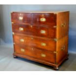 An Early 19th Century Two Part Campaign Chest with brass corner mounts and sunken brass handles