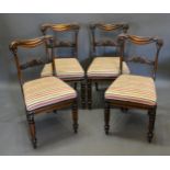 A Set of Four William IV Mahogany Dining Chairs, each with a shaped carved rail back above a drop in