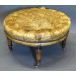 A Leather Buttoned and Brass Studded Footstool of circular form with turned tapering legs and