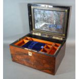 A 19th Century Rosewood and Mother of Pearl Dressing Case, the hinged cover enclosing a fitted