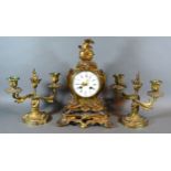 A French Three Piece Clock Garniture, the clock with enamel dial with Arabic and Roman numerals